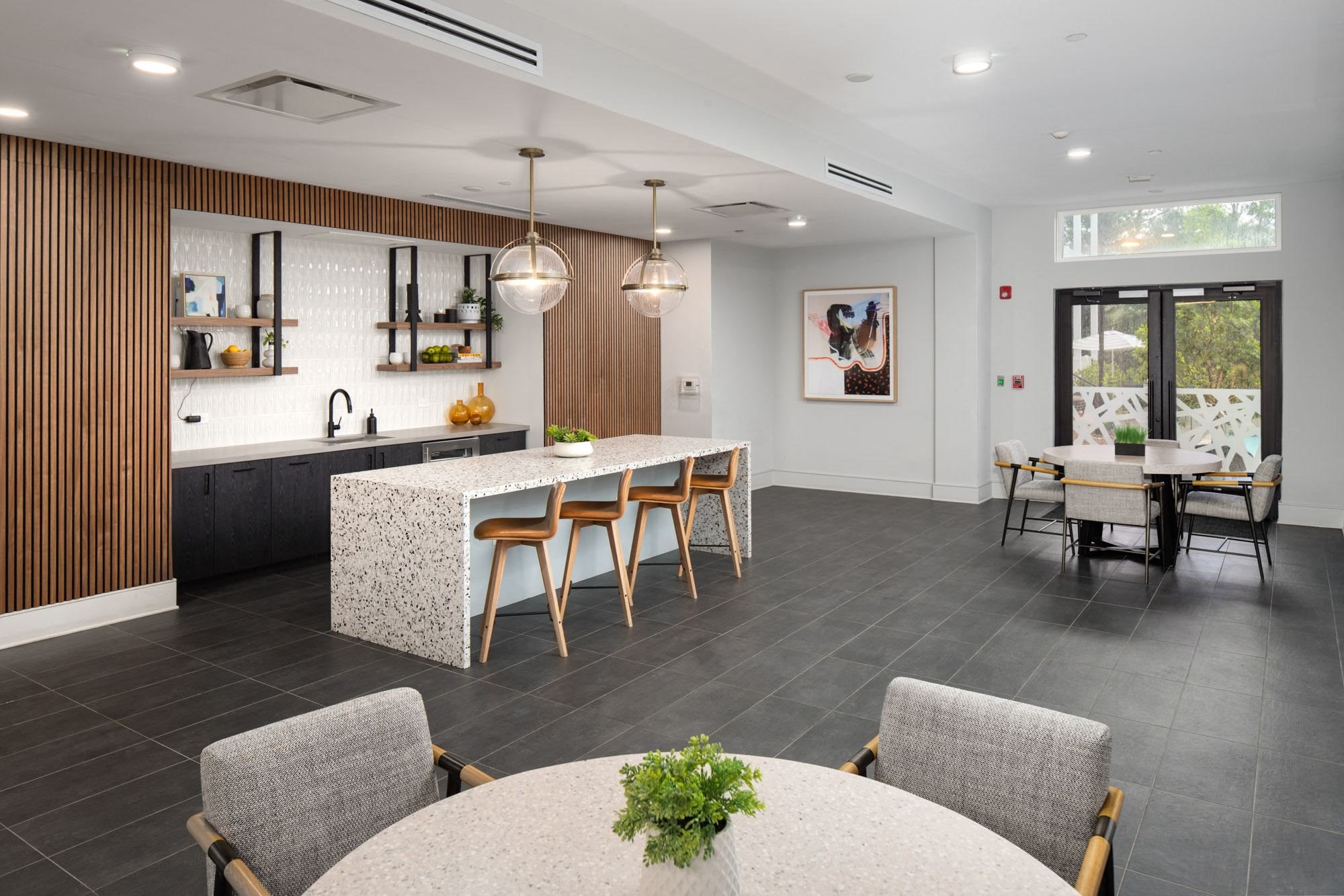 a kitchen and dining room with a table and chairs